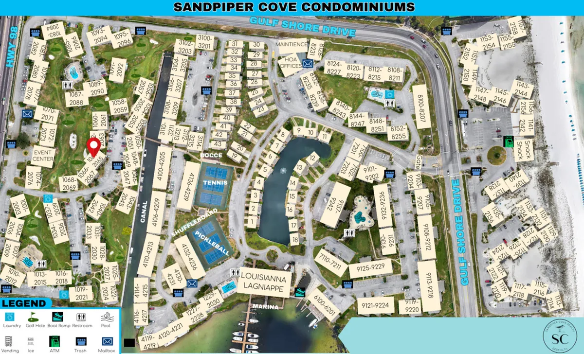 An aerial view displays the Sandpiper Cove community, including the par-3 golf course, multiple condo buildings, a marina with boat docks, and nearby beach access. The landscaped grounds and recreational facilities are clearly visible, offering a sense of scale and the variety of available activities.